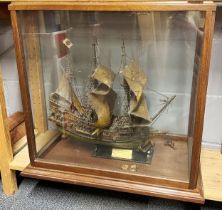 A large antique cased model galleon, cased size 64 x 37 x 59cm.