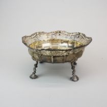 A heavy hallmarked silver pierced bowl raised on four feet. 25 x 13cm.