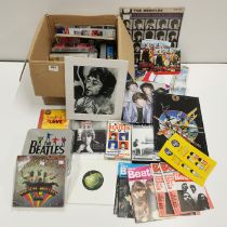 An extensive collection of Beatles memorabilia including photos, records, CDS, DVDS etc.