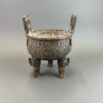 A Chinese archaic form bronze censer, H. 26cm.