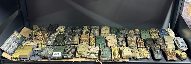 A large group of mixed diecast and plastic model military vehicles.
