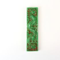 A Chinese carved jade scroll weight, 16.5 x 4.5cm.