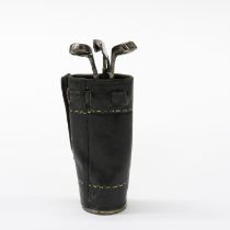 A vintage leather golf bag and four silver golf club manicure items, club L. 8.5cm.