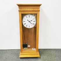A light oak cased London Clock company Westminster-Whittington wall clock, H. 70cm.