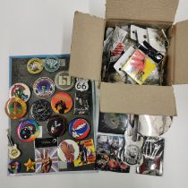 A large quantity of rock and pop related pin badges.