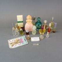 A quantity of vintage perfume bottles, mostly full or part used.