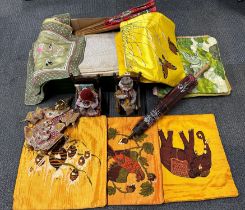 A quantity of oriental cushion covers and other items.