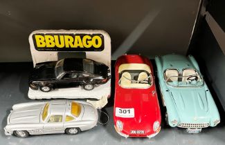 A group of four Burago diecast model vehicles, longest L. 25cm.