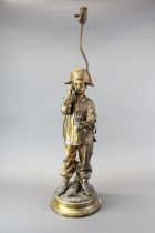 A large 19thC gilt bronze figure mounted as a lamp base. Figure H. 63cm , Lamp H. 87cm.