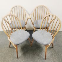 A set of four 1960's Windsor (2056) Ercol dining chairs with Ercol cushions, H. 82cm.