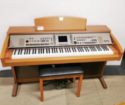 A Yamaha Clavinova CVP-305 digital piano/ arranger in cherry, 150 x 105 x 58cm.