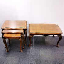 A carved and burr walnut veneered coffee table together with a matching nest of three tables, both