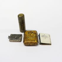 A trench art lighter and three other related items.