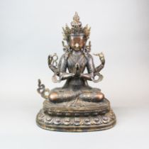 A large Tibetan bronze figure of a seated Tara, H. 46cm.
