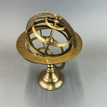 A Brass astrological desk globe, H. 27cm.
