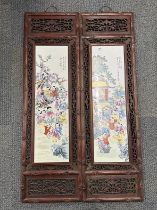A pair of Chinese hardwood framed porcelain panels. 36 x 121cm.