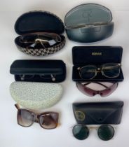 A collection of vintage sunglasses.