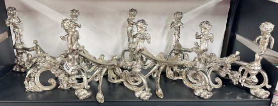 Four heavy silver plated metal cherub mirror stands, W. 38cm (no mirrors).