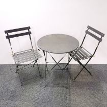 A circular metal garden table with two matching chairs, table H. 71cm Dia. 60cm.