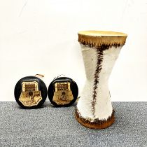An African skin drum, H. 47cm, and two other instruments.
