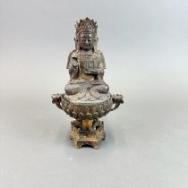 A Tibetan gilt bronze censer featuring a seated deity, H. 23cm.