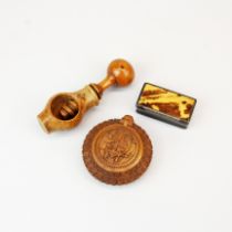 A carved cattle horn snuff box, with an eastern carved wooden snuff box and a turned walnut wood nut
