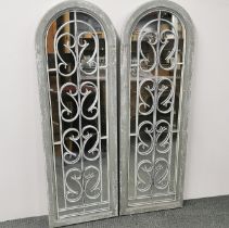 A pair of contemporary metal and wooden garden mirrors, 124 x 41cm.