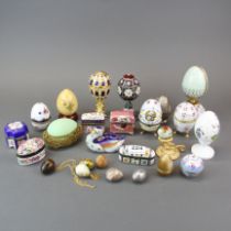 A collection of enamelled and porcelain boxes , eggs and figures, Tallest H. 16cm.