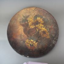 A large hand-painted terracotta plate. Dia. 53cm.