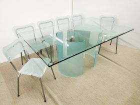 A heavy quality glass dining table with frosted glass base and a set of six matching frosted glass