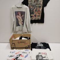 A box of 21pop related t shirts.