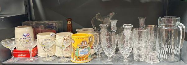 A group of bar advertising items including four Babycham glasses and a group of glassware.