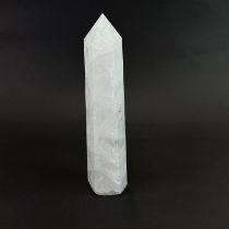 A large polished quartz crystal point, H. 29cm.