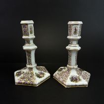 A fine pair of 19th century hand painted Berlin porcelain candlesticks, H. 13.5cm.