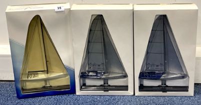 Three boxed diecast Mariner models of racing yachts. Box height is 41cm