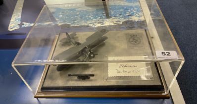 A cased die cast model of a Swordfish MKI biplane, limited edition 97/100, Signed by 3 pilots.