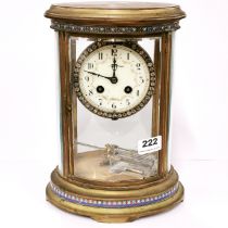 An early 20th C oval four glass and cloisonne decorated mercury pendulum clock, H. 29cm.