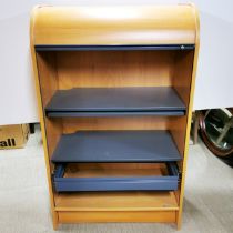 A roll top teak effect cabinet with metal shelves and slide out writing platform, 140 x 84 x 50cm.