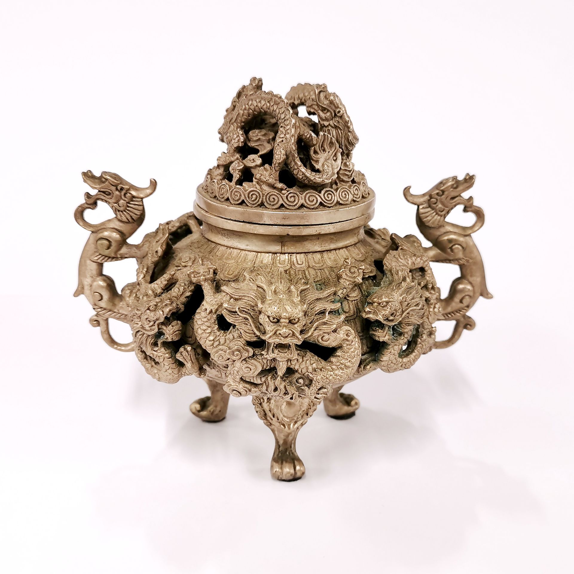 An ornate Chinese silvered metal dragon censer, H. 16CM.