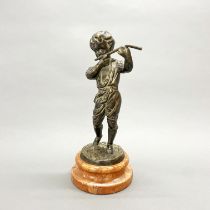 A bronze figure of a boy playing a flute on a marble base, H. 27cm.