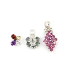 Three 925 silver stone set pendants, including amethyst, citrine and white topaz, largest L. 3.2cm.