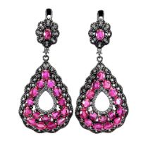 A pair of large 925 silver drop earrings set with oval cut rubies and white stones, L. 4.5cm.