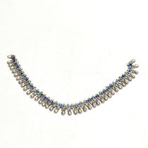 An enamelled Eastern white metal anklet, L. 25cm.