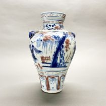 A Chinese hand painted porcelain vase with underglaze blue and red decoration, H. 34cm.