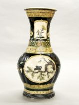 A Chinese Famille noir decorated stoneware vase, drilled as a lamp base, H. 42cm.