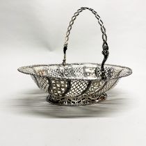 A large Georgian hallmarked silver pierced basket with armorial detail, 34 x 28 x 26cm.