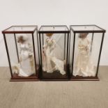 Three cased Franklin Mint porcelain bride dolls, case size 34 x 34 x 64cm.