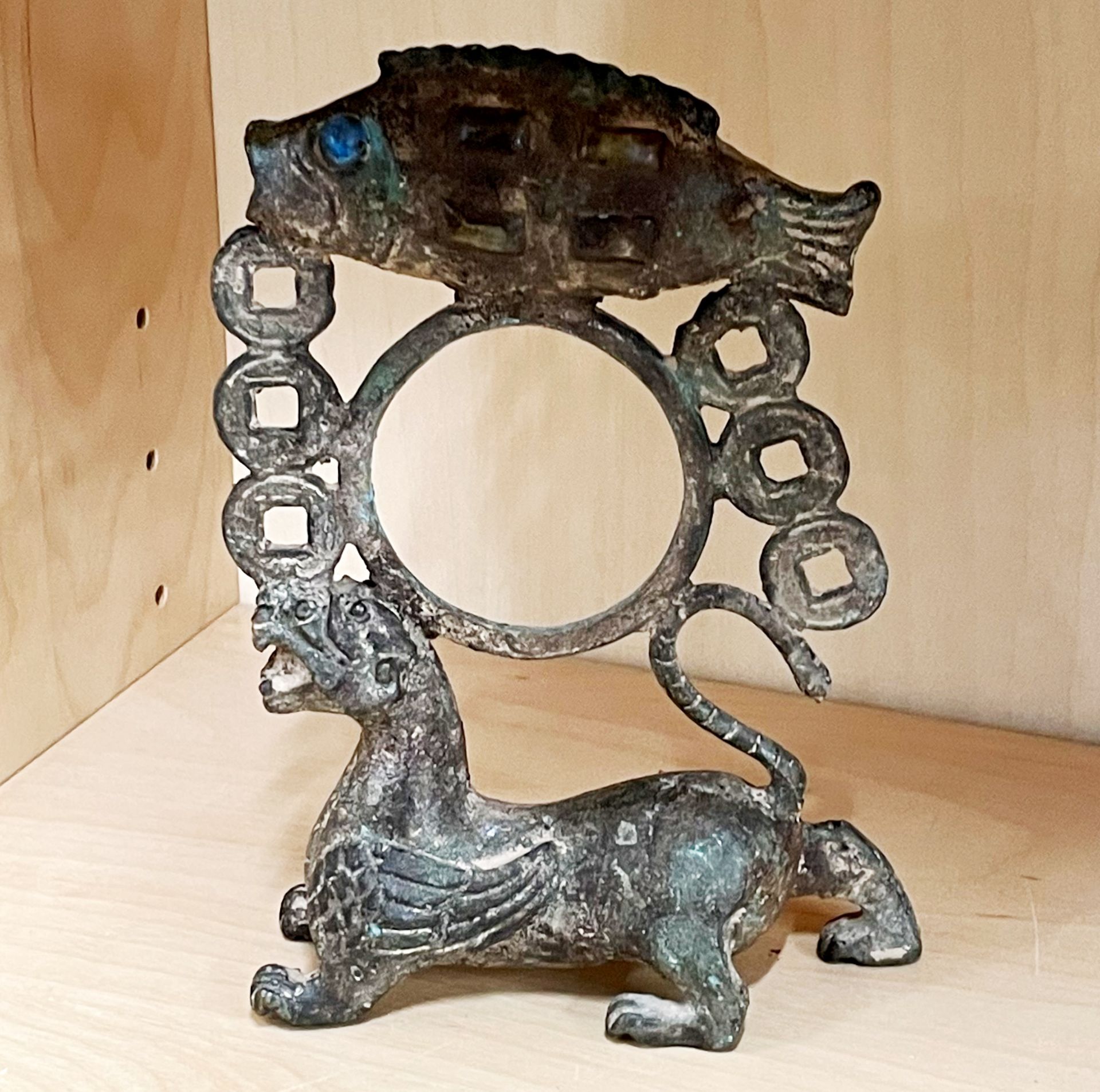 An unusual Chinese bronze archaic form figure featuring a mythical winged creature, a fish inset - Image 2 of 2