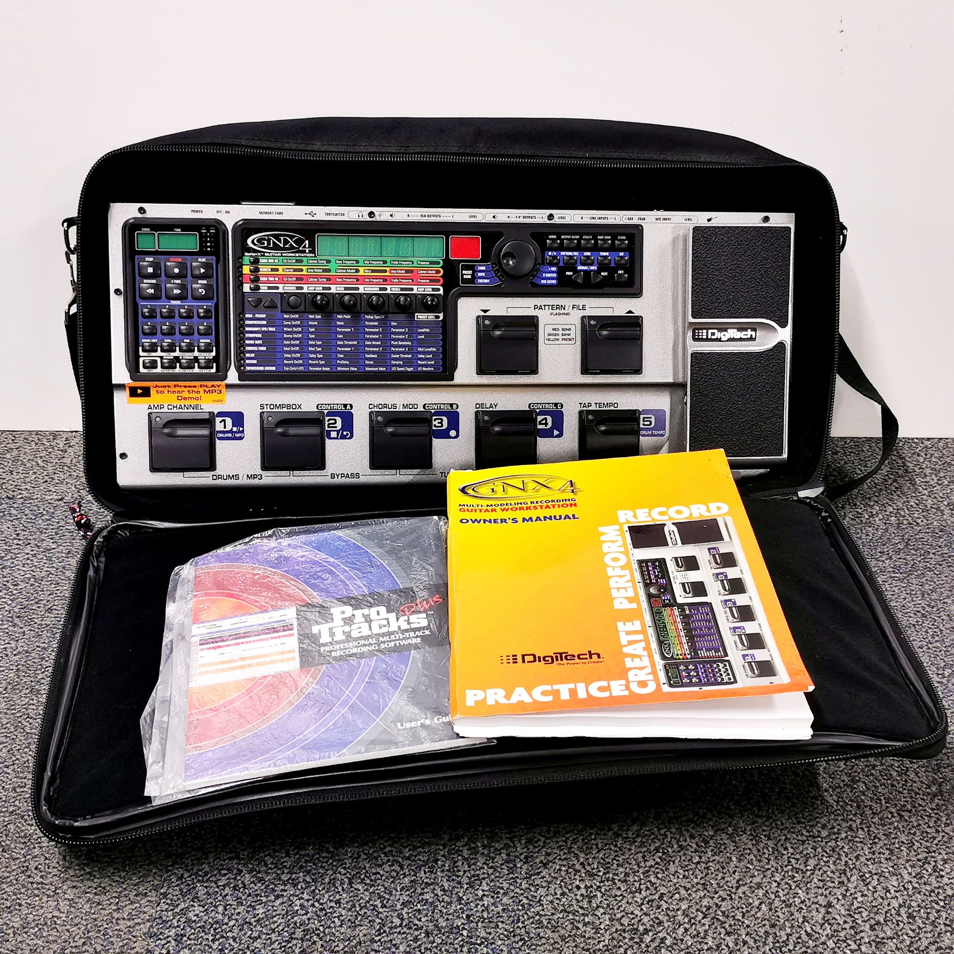 A cased Digitech GMX4 GeNetx guitar work station, 55 x 23cm, with various associated equipment and