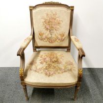 An early 20th C French floral upholstered armchair, H. 97cm.